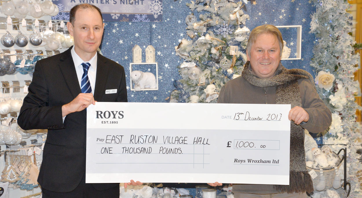 Andrew Banthorpe - Roys Wroxham Department Store manage, presenting a cheque to Mick Sims - East Ruston Village Hall Treasurer